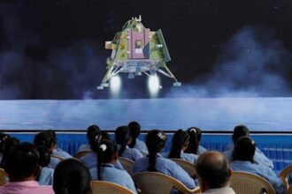 People watching the successful landing of India's Space Mission in Banglore